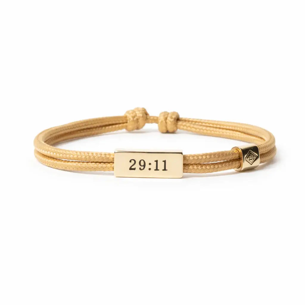 Gold bracelet with a rectangular tag displaying '29:11' on a white background