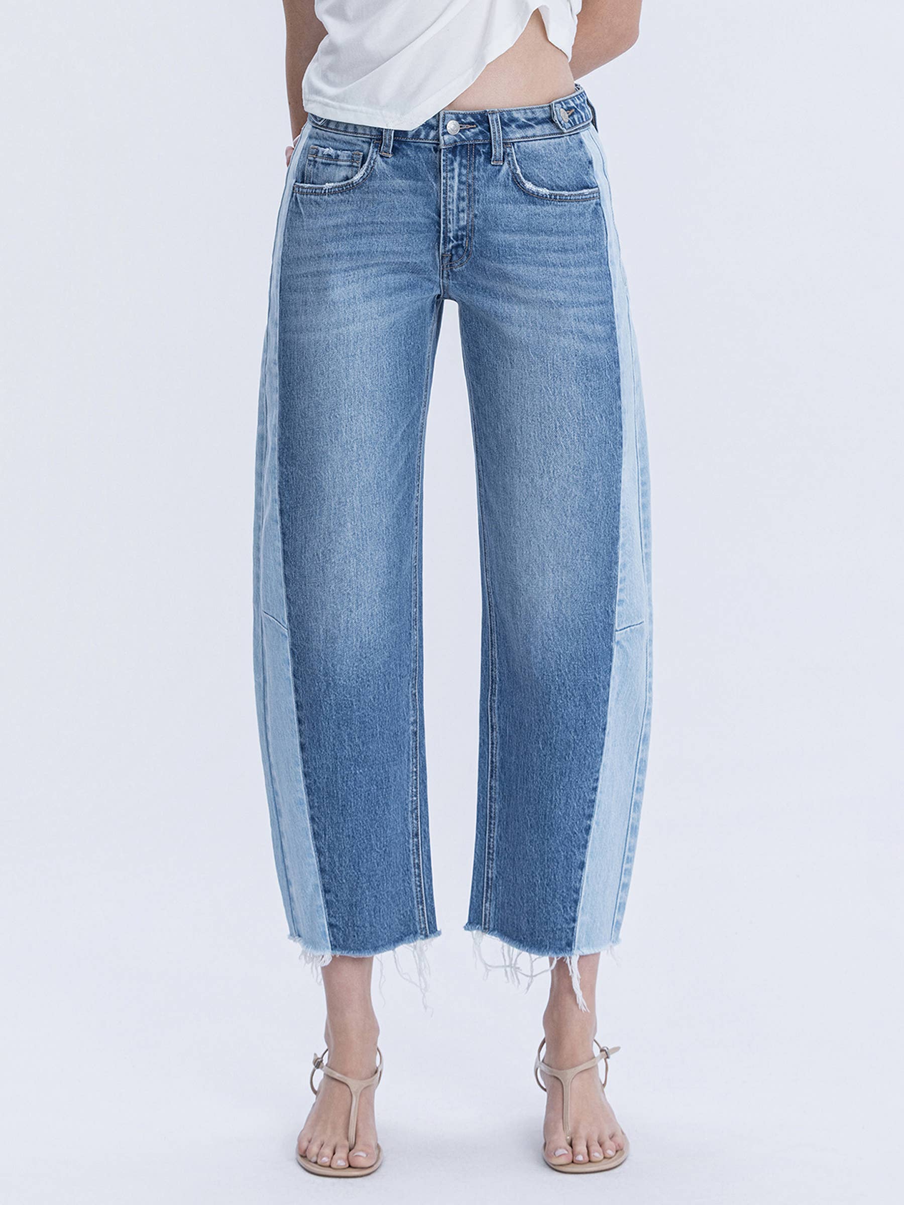 Two toned blue jeans with a white background.
